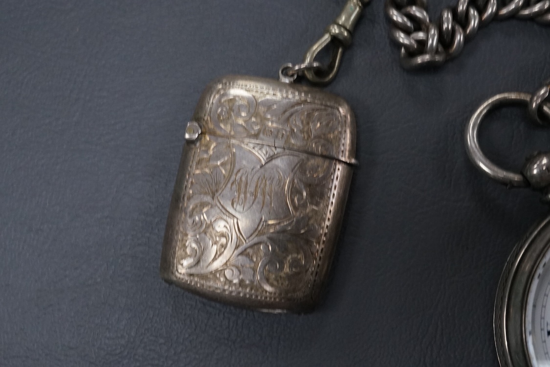 A late Victorian silver open faced key wind pocket watch, with Roman dial and subsidiary seconds, case diameter 52mm, on a heavy silver curb link albert, hung with a silver vesta case and a watch key, together with a con